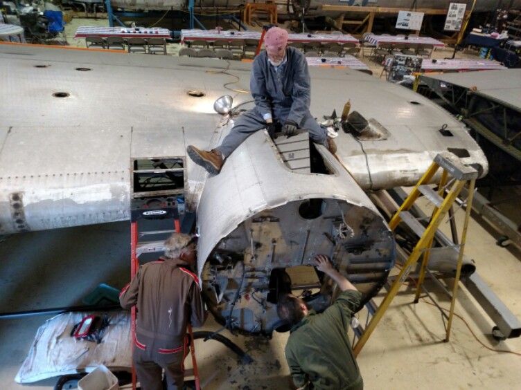 Volunteers working on the B-17 Lacey Lady in Salem