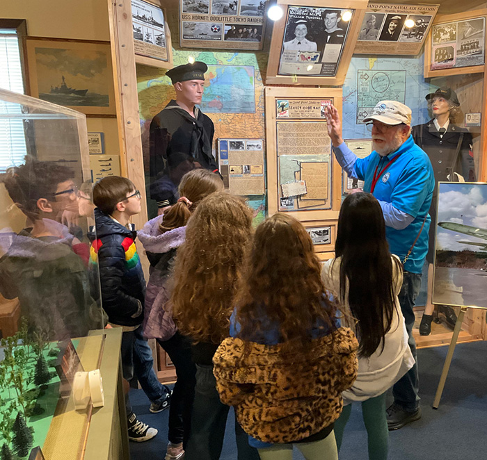 Docent giving a museum tour to children