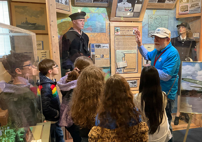 Docent giving a museum tour to children