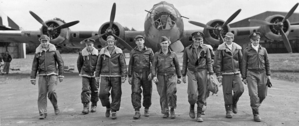 WWII Airmen walking away from a B-17